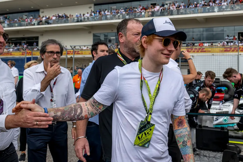 Formula 1 VIP hospitality access with celebrity guests, event staff and paddock management teams