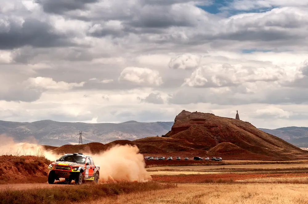 Off-road rally event requiring transportation for drivers, teams, VIP guests and event personnel