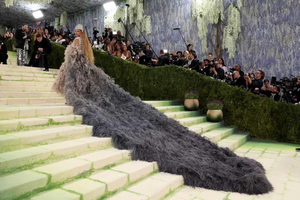 Met Gala red carpet arrival with photographers and guests at the annual New York event