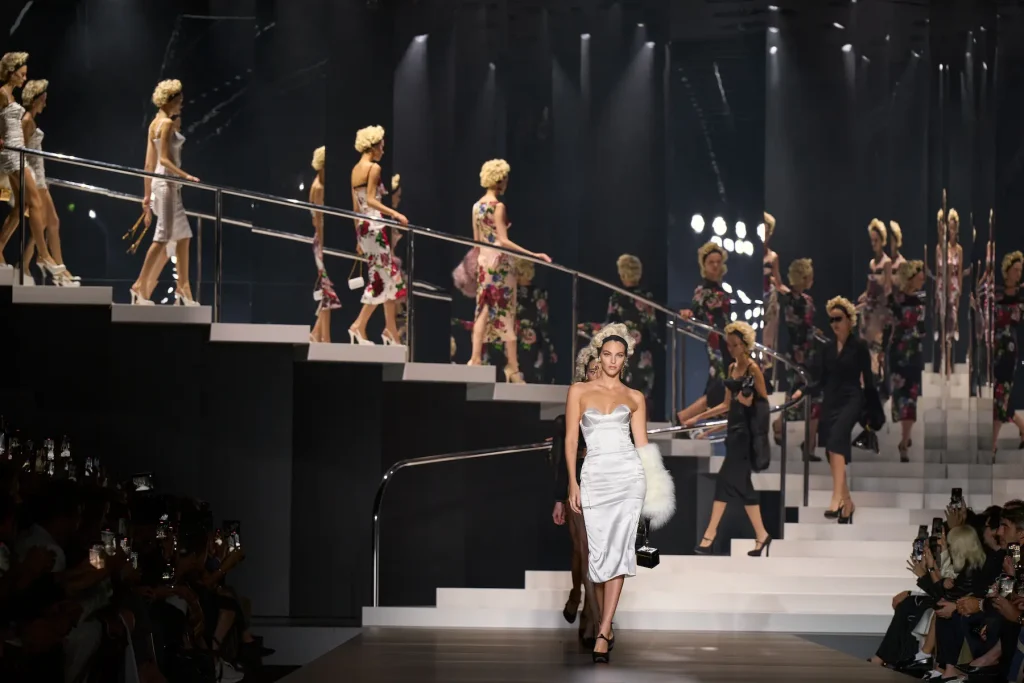 Milan Fashion Week runway show with models presenting a designer collection