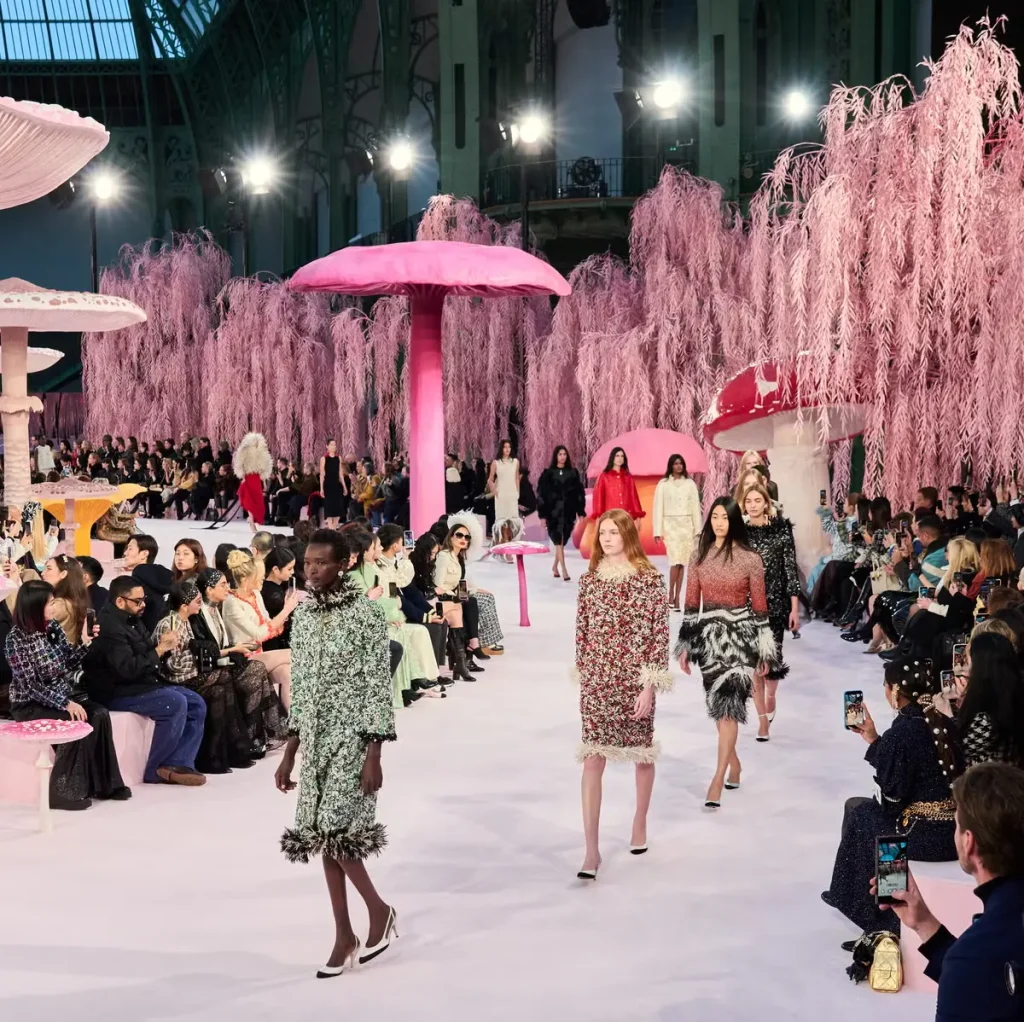 Paris Fashion Week runway show with models and guests attending the fashion event