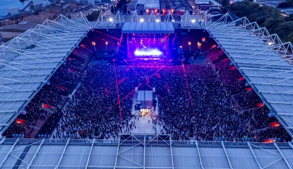 Major stadium concert with a large audience and live stage production